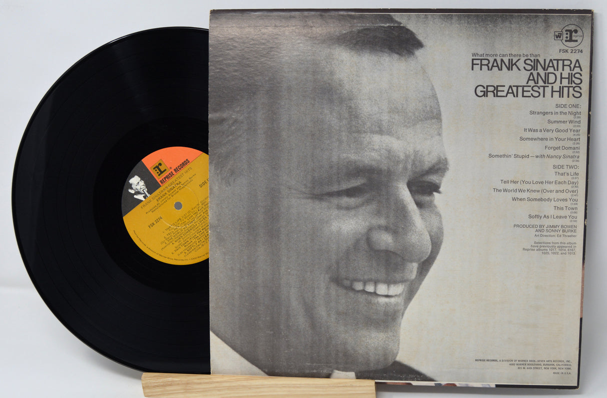 Vinyl record with cover featuring a portrait of Frank Sinatra and text 'Frank Sinatra and His Greatest Hits'.