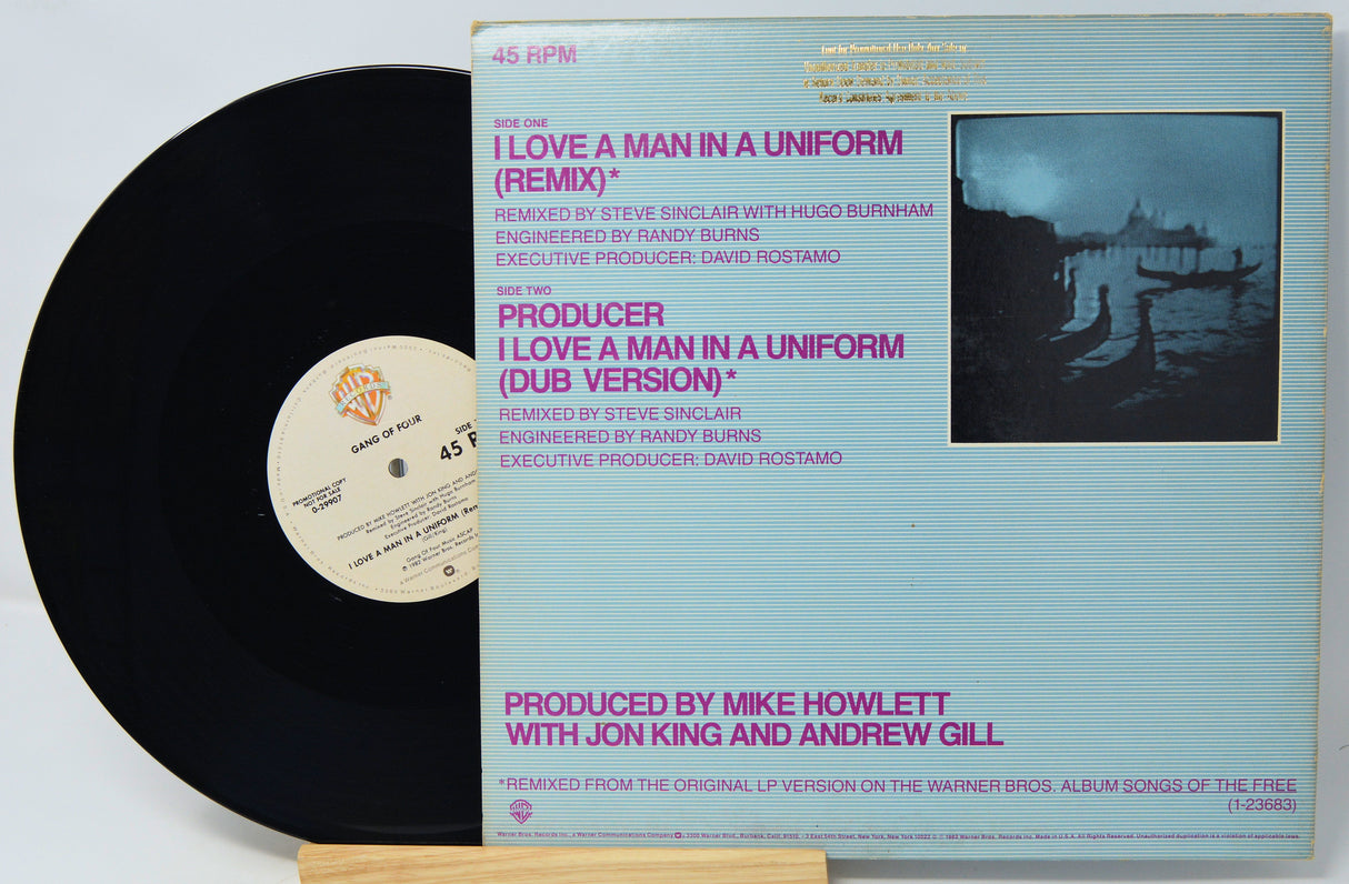 Vinyl record with cover featuring text and a black and white image of people on a boat.