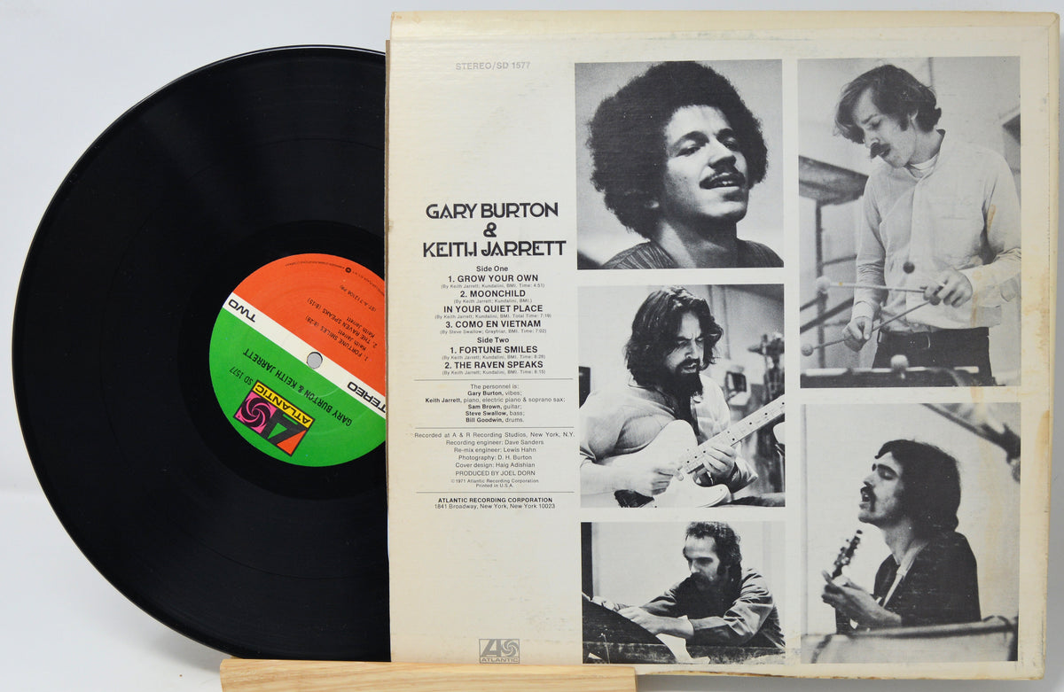 A vinyl record partially pulled from its sleeve, showing the black record on the left and the cream-colored album cover on the right. The cover features black-and-white photos of Gary Burton and Keith Jarrett, with the title 'Gary Burton & Keith Jarrett' and track listing visible.
