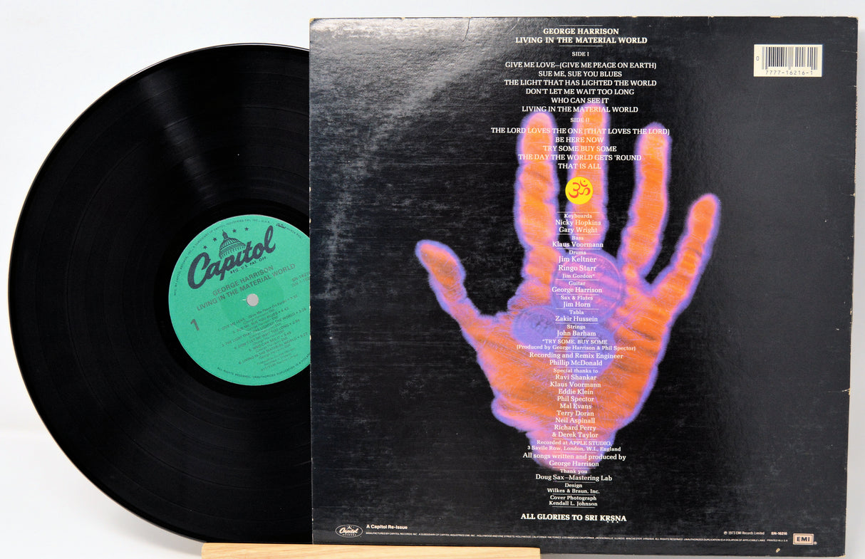 Vinyl record with a colorful hand illustration on the cover