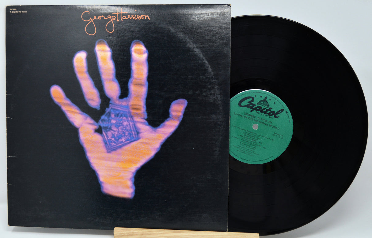 Vinyl record with a hand illustration on the cover and 'Capitol' label.