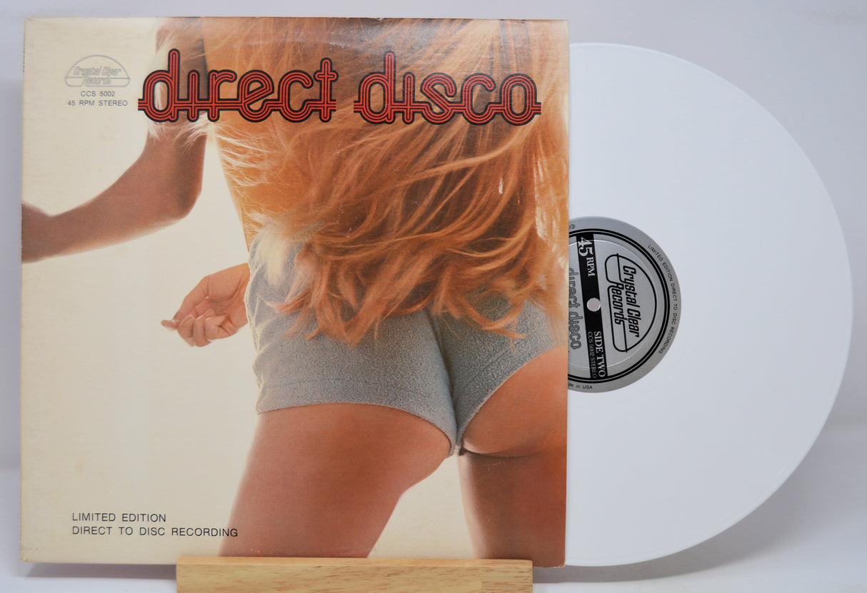 Vinyl record with a cover featuring a person with red hair and the text 'direct disco'.