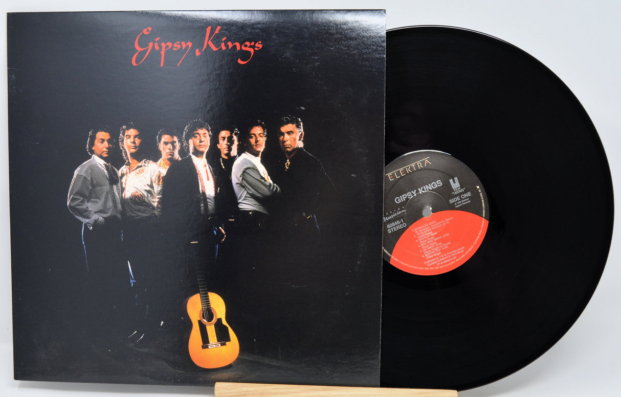 Vinyl record with cover featuring a band and guitar illustration, titled 'Gipsy Kings'.