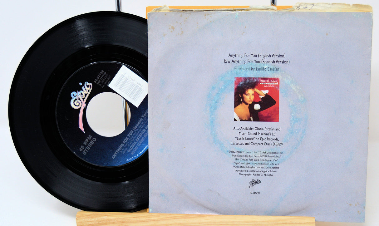 Back cover and vinyl record of Gloria Estefan and Miami Sound Machine's 'Anything For You' 45 RPM single