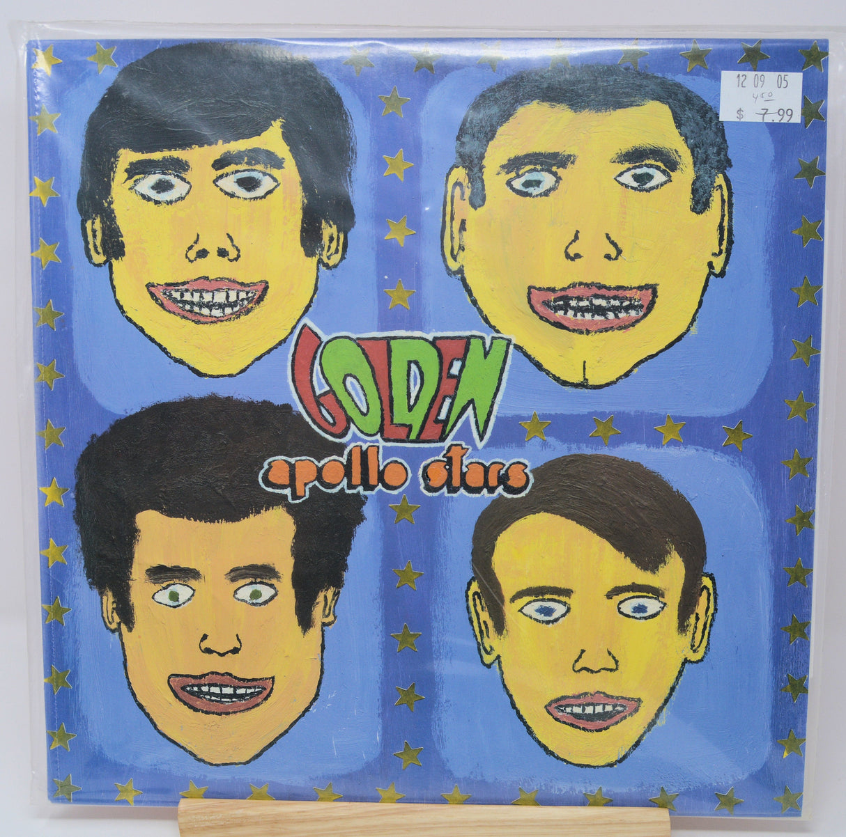 Golden Apollo Stars vinyl record front cover with illustrated portraits and vivid stars