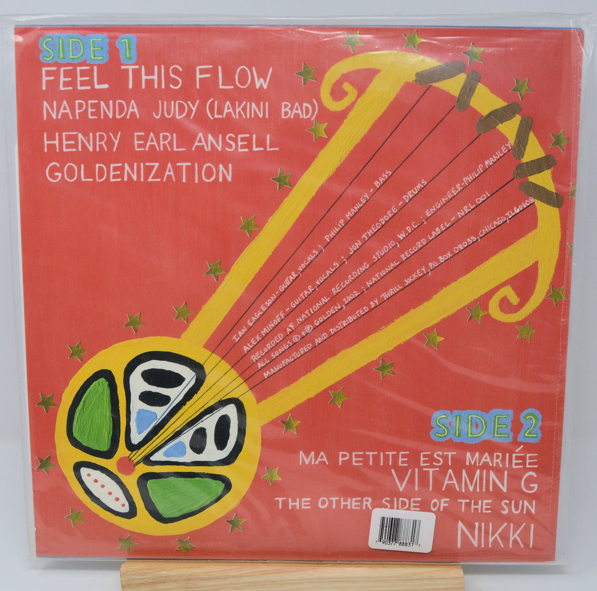 Golden Apollo Stars vinyl record back cover with colorful abstract guitar, stars, and song titles