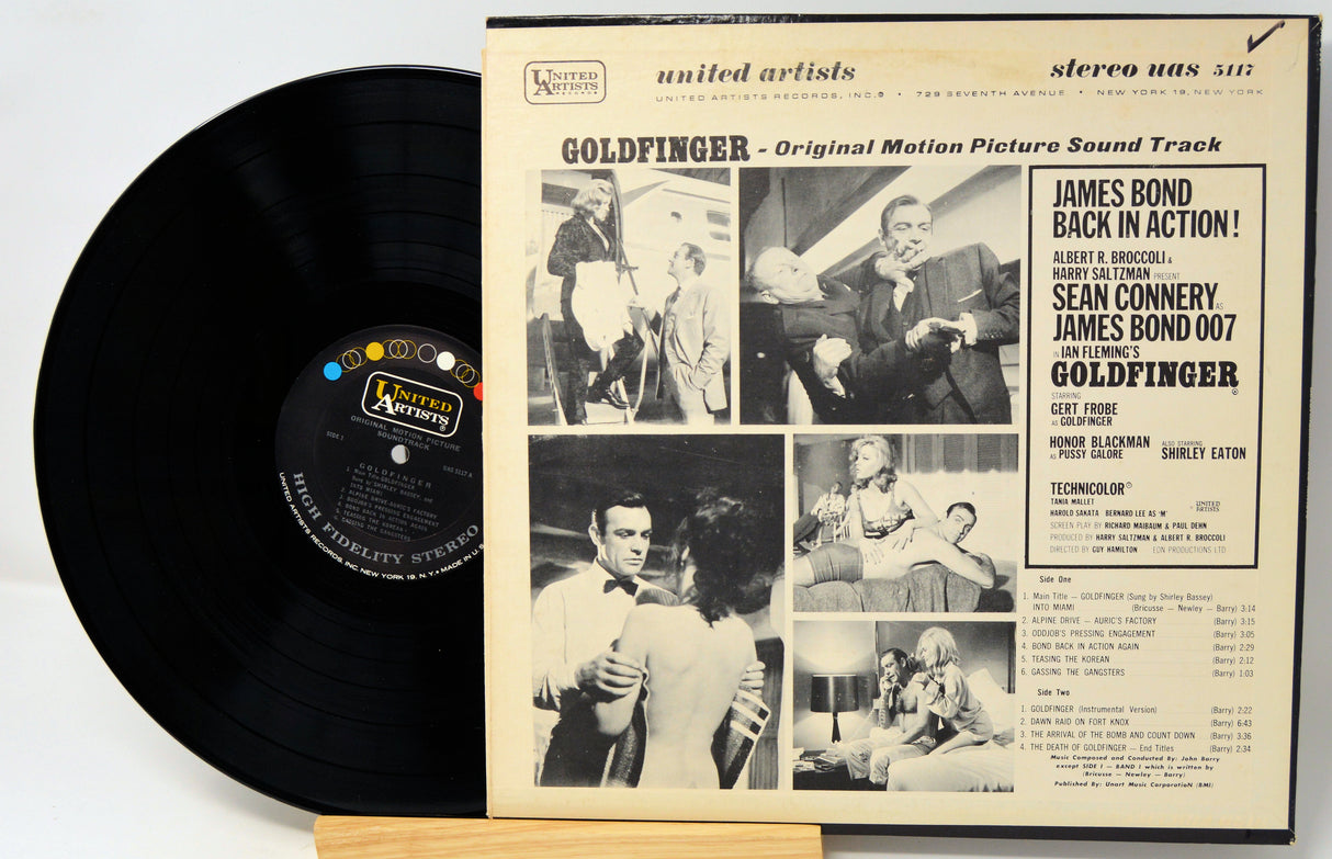 Vinyl record with 'Goldfinger' soundtrack cover featuring black and white images and text.
