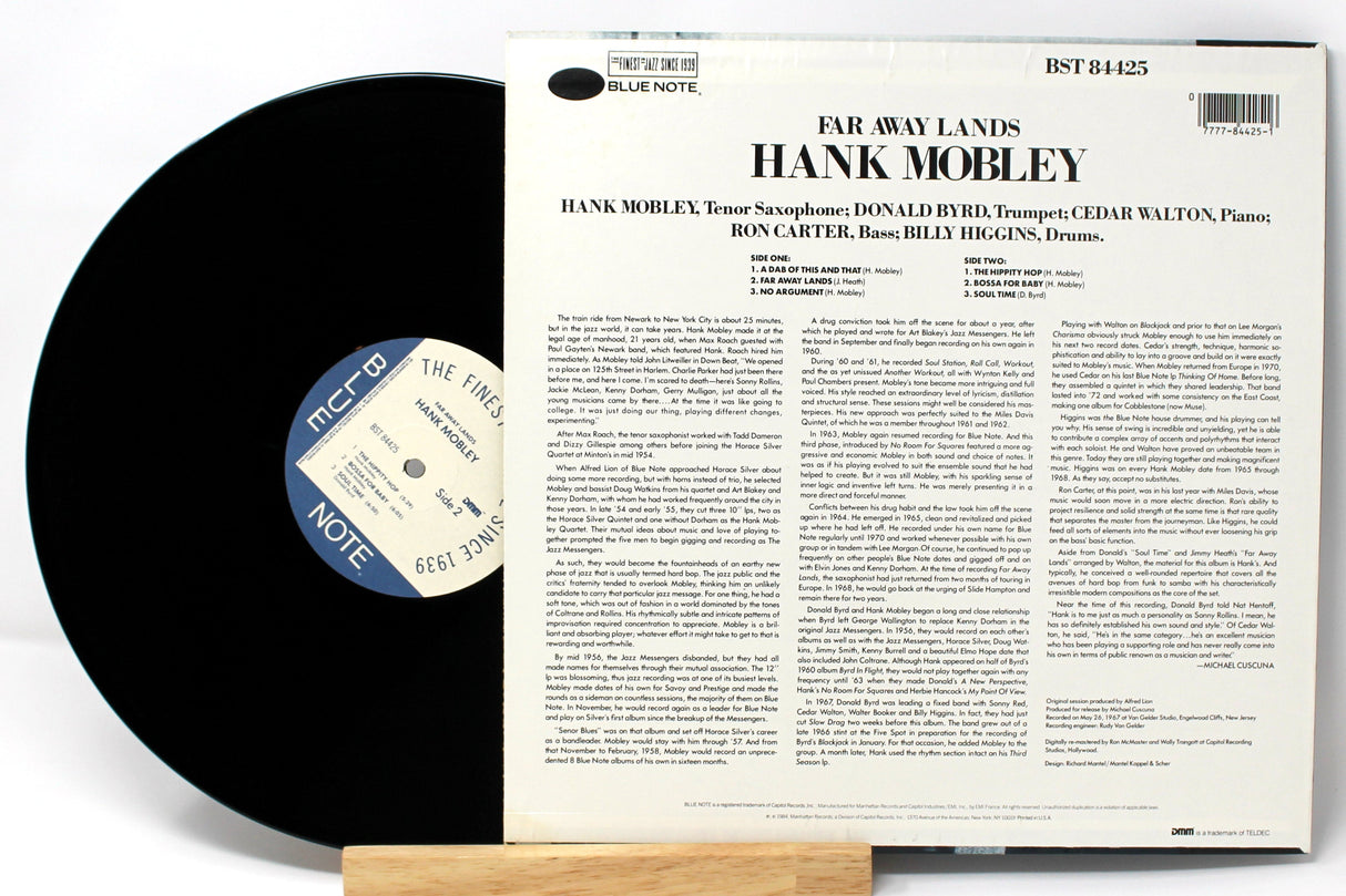 Back cover and vinyl record of Hank Mobley's 'Far Away Lands' Blue Note LP showing track list and liner notes