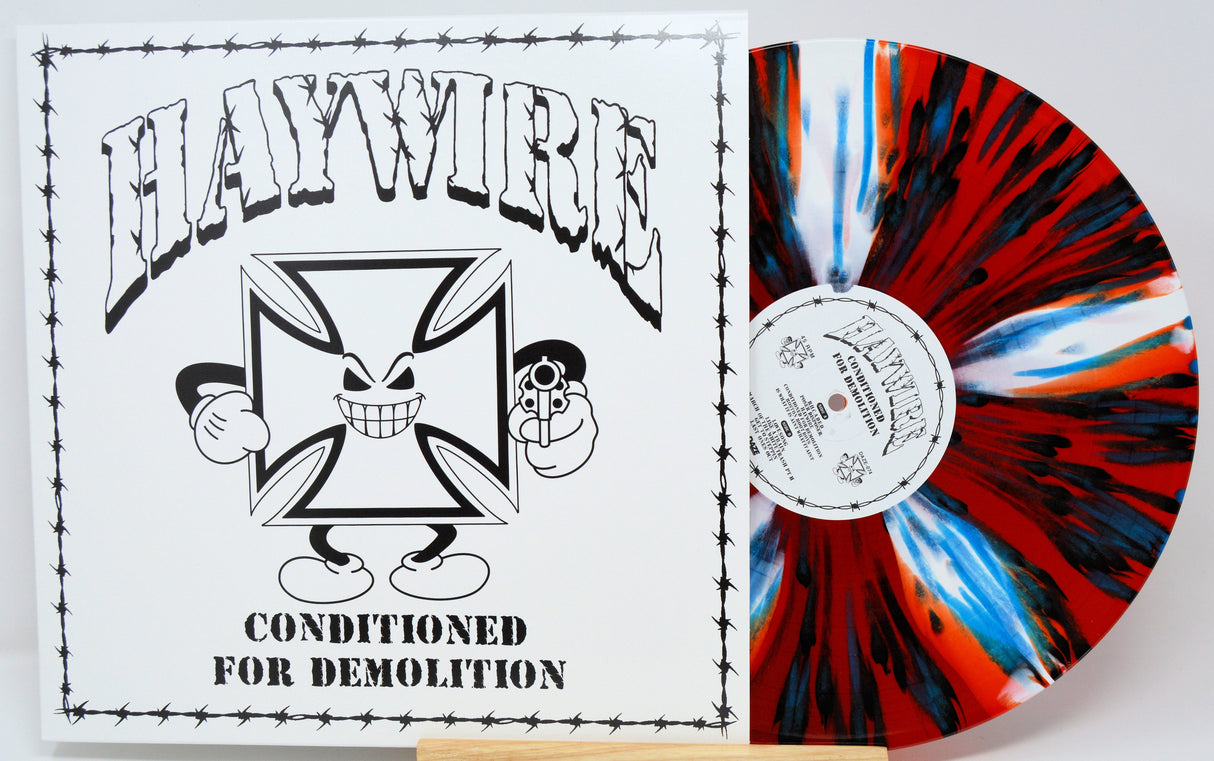 Haywire Conditioned for Demolition LP front cover and red, black, and blue splatter vinyl record