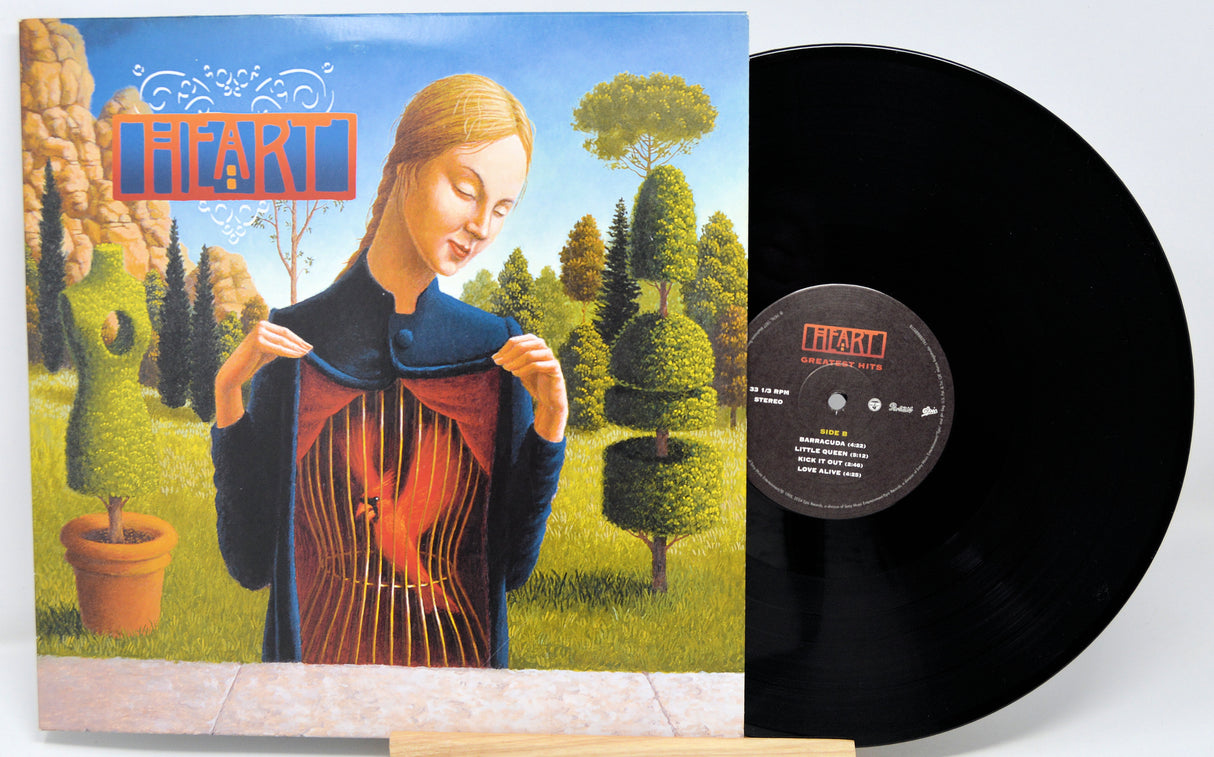 Vinyl record with a colorful cover featuring a stylized portrait and nature elements.