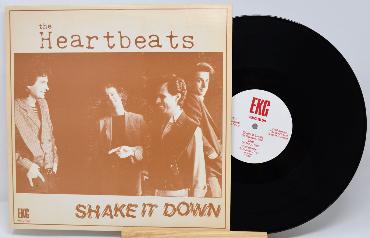 Vinyl record with 'The Heartbeats' album cover featuring a group of people.