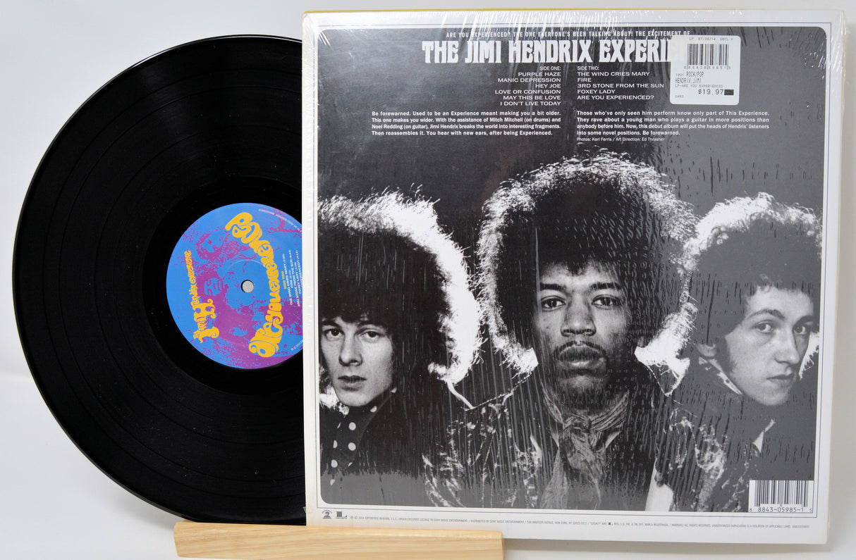 Vinyl record and cover of 'The Jimi Hendrix Experience' on a white background