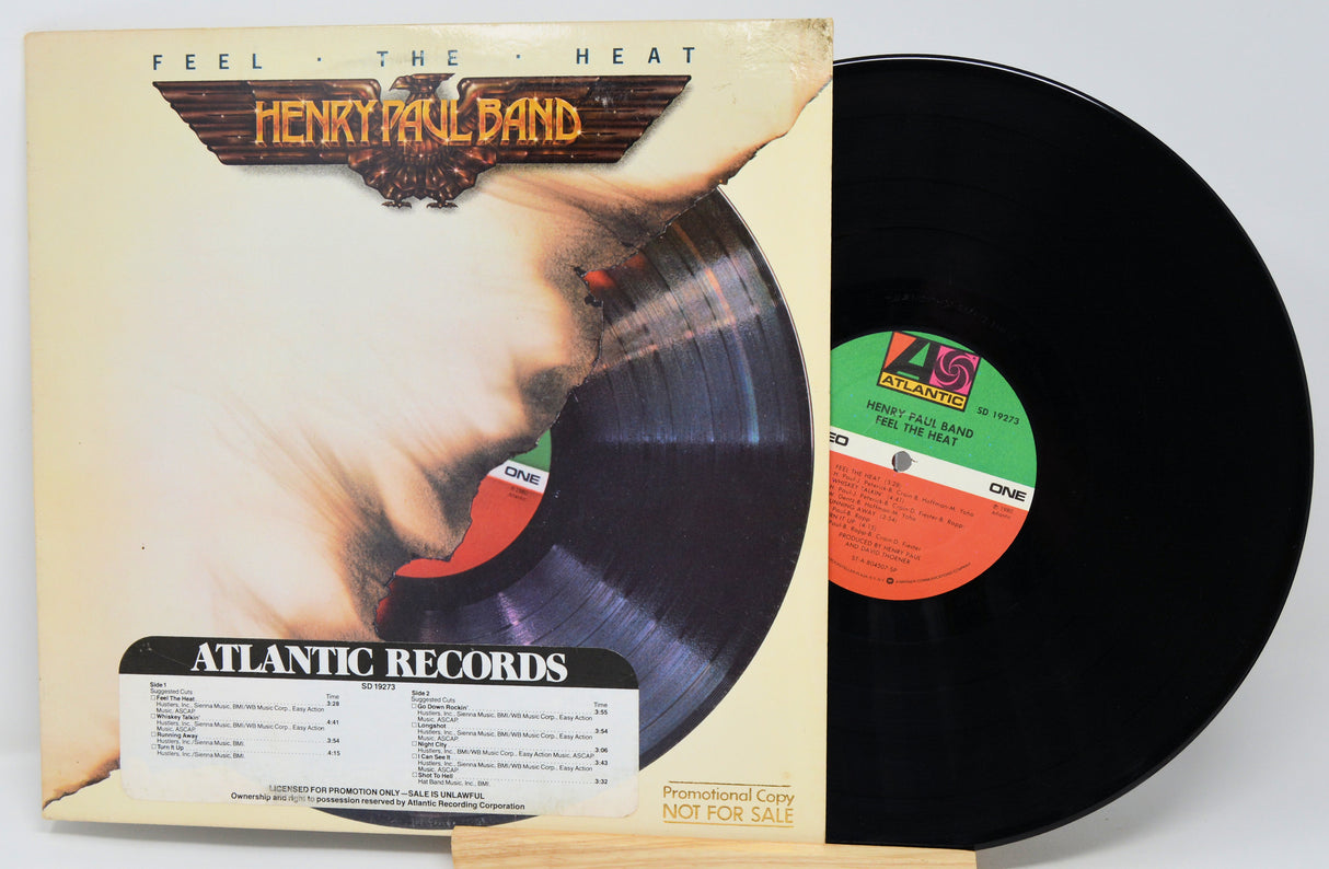 Vinyl record with cover featuring a hand holding a record, labeled 'Henry Paul Band' and 'Atlantic Records'.