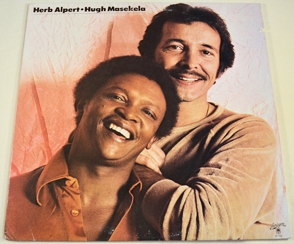 Front cover portrait of Herb Alpert and Hugh Masekela smiling together on their collaboration album