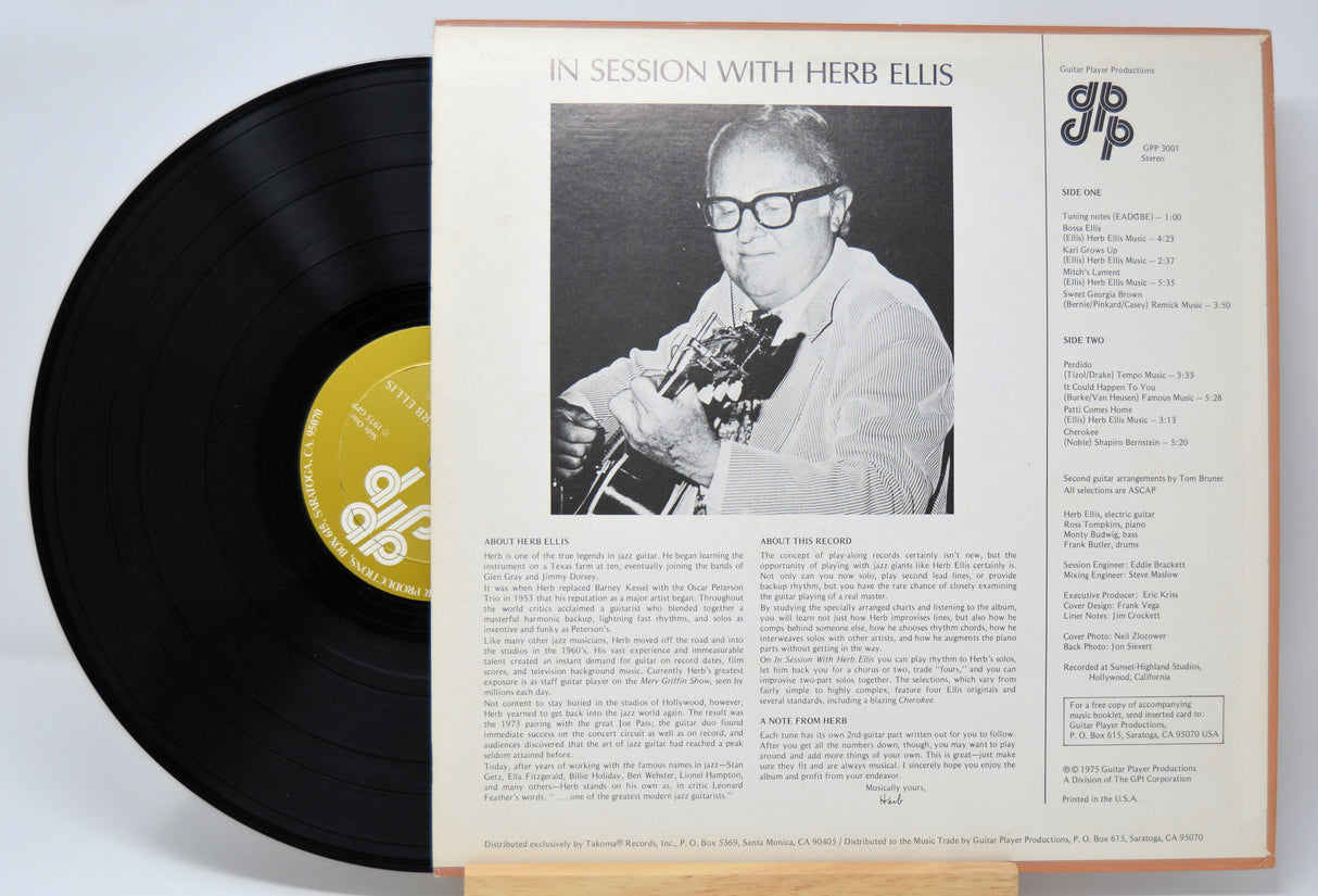 'Herb Ellis In Session With' Vinyl record with cover featuring a black and white photo of a person playing guitar and text.