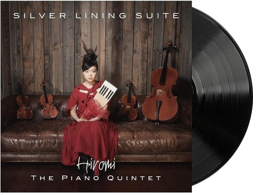 Cover of the album 'Silver Lining Suite' by Hiromi, featuring an image of a person sitting with a piano in the background, surrounded by several parked violins.