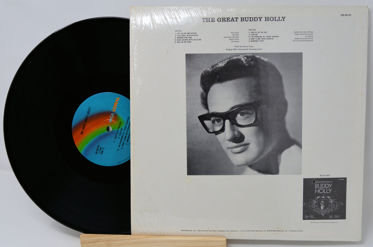 Vinyl record and cover featuring a portrait of Buddy Holly on a white background