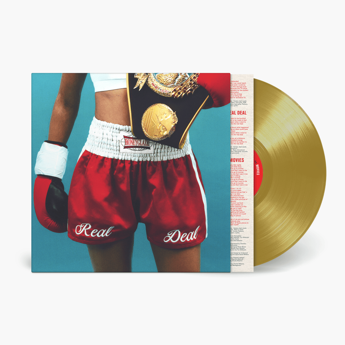 Honeyglaze Real Deal gold vinyl LP with boxer in red gloves, champion belt, and 'Real Deal' shorts