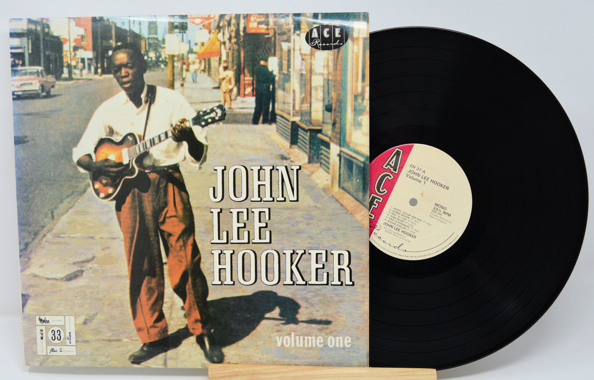 Vinyl record with cover featuring John Lee Hooker on a city street