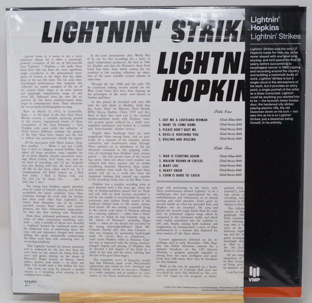 Vinyl record album cover for 'Lightnin' Strikes' by Lightnin' Hopkins, showing the back cover with printed text, track listing, and VMP logo.