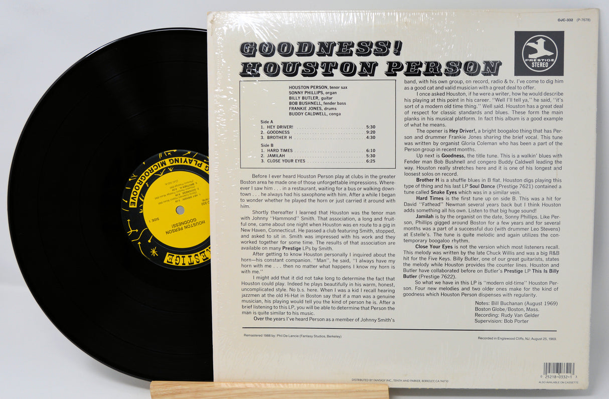 Vinyl record with its cover displaying text and a logo.
