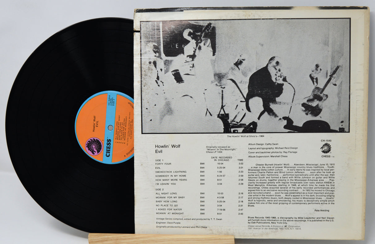 Vinyl record with a black cover and orange label, featuring a jazz band illustration on the back.