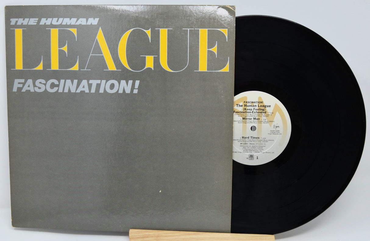Vinyl record with 'The Human League' album 'Fascination!' on a white background