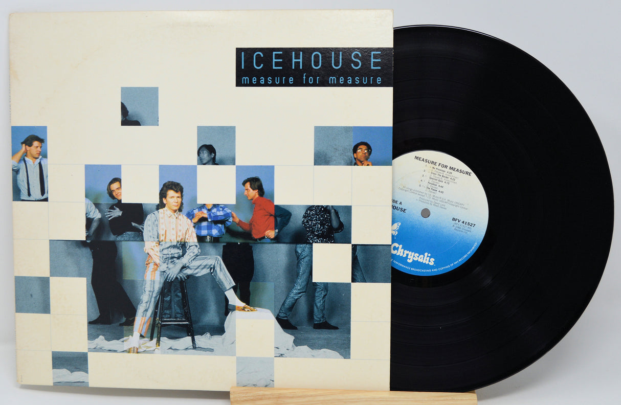 Vinyl record with cover featuring a collage of people and 'Icehouse' album text.