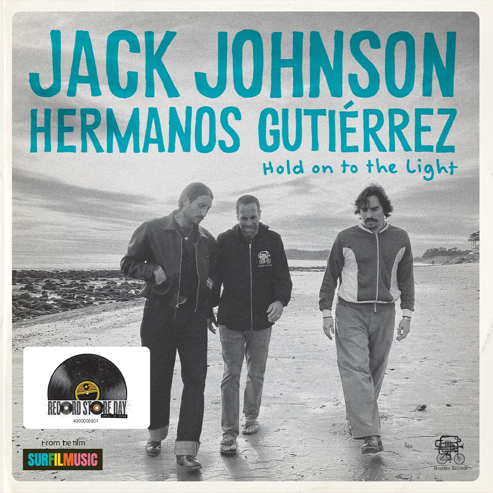 Album cover for 'Hold on to the Light' by Jack Johnson Hermanos Gutierrez with three people walking on a beach.