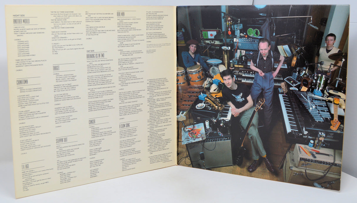 Inside gatefold cover of Joe Jackson's vinyl record showing the song titles and lyrics along with a picture of the band.