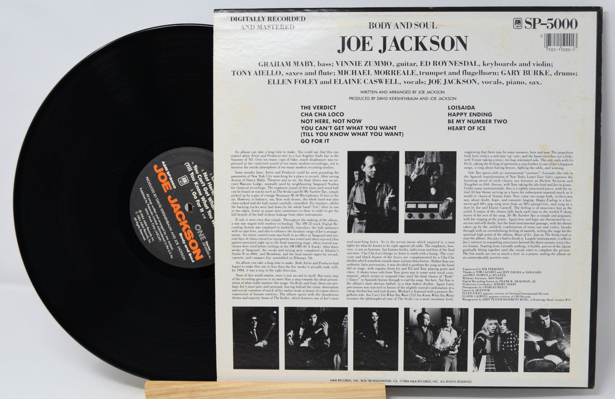 Vinyl record with its cover featuring Joe Jackson on a light gray background