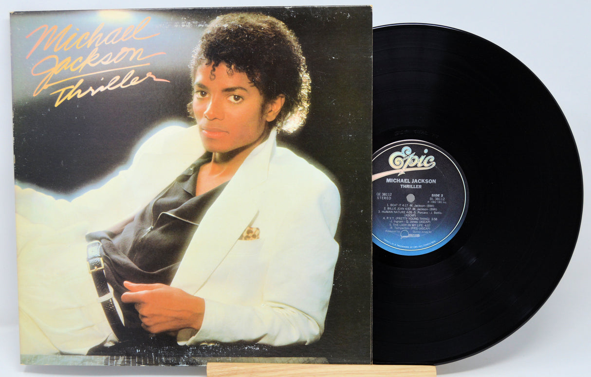 Michael Jackson 'Thriller' album cover and vinyl record on a white background