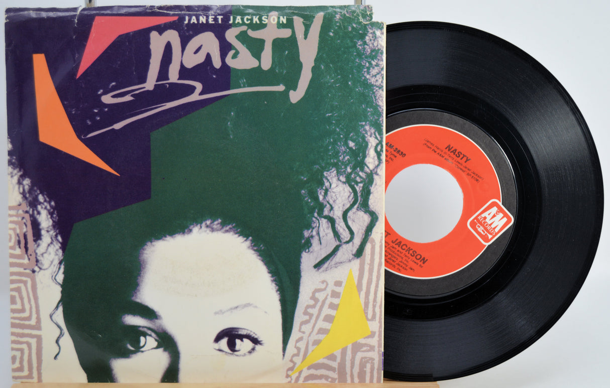 Vinyl record with cover featuring Janet Jackson's 'Nasty' single