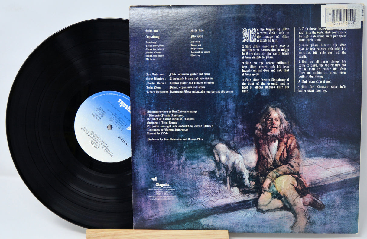 Vinyl record with a cover featuring an illustration of a person and a dog in a dimly lit room.