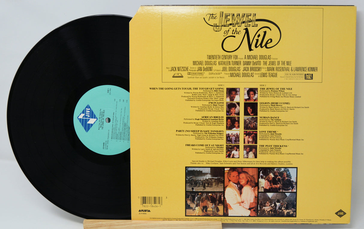 Vinyl record with yellow cover featuring text and images on a light gray background