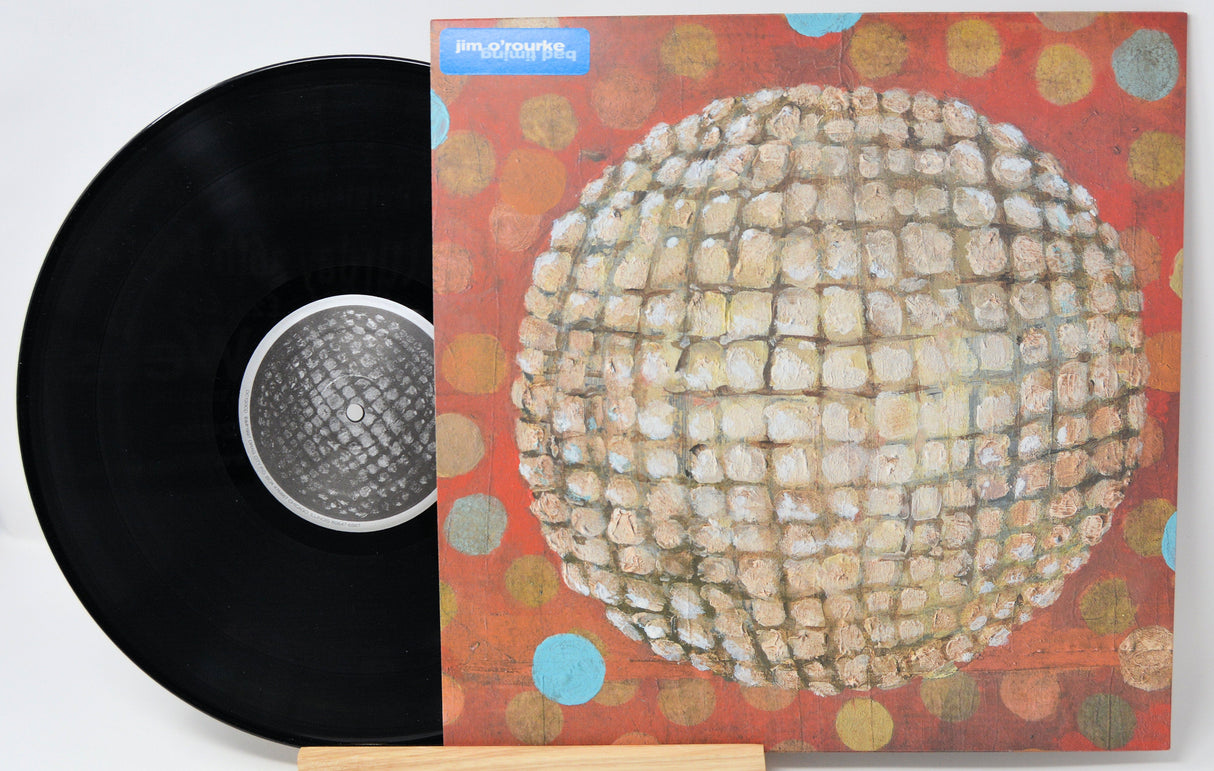 Jim O'Rourke Eureka vinyl record partially inside its colorful, textured album cover with abstract art