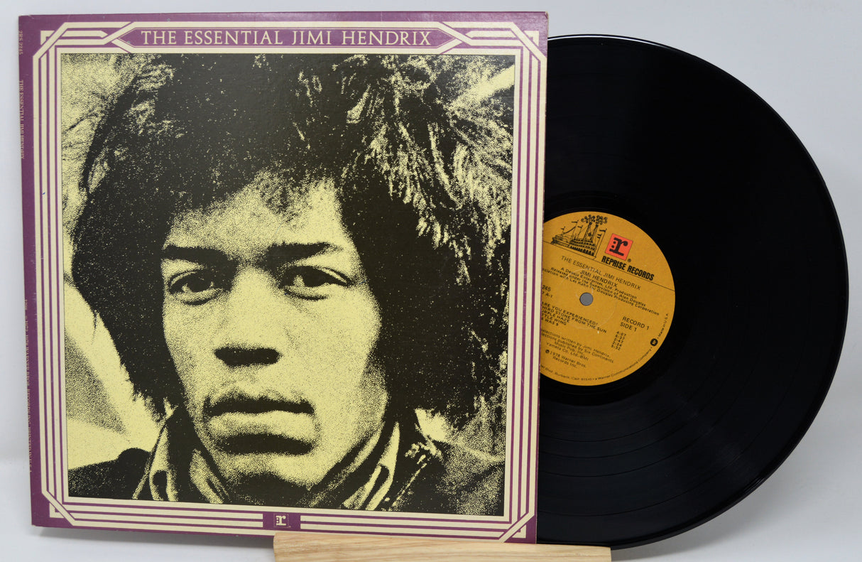 Vinyl record with a colorful cover featuring four band members.