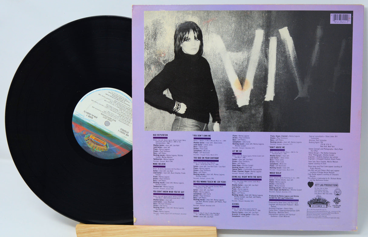 Vinyl record with a black cover featuring a person and album details.