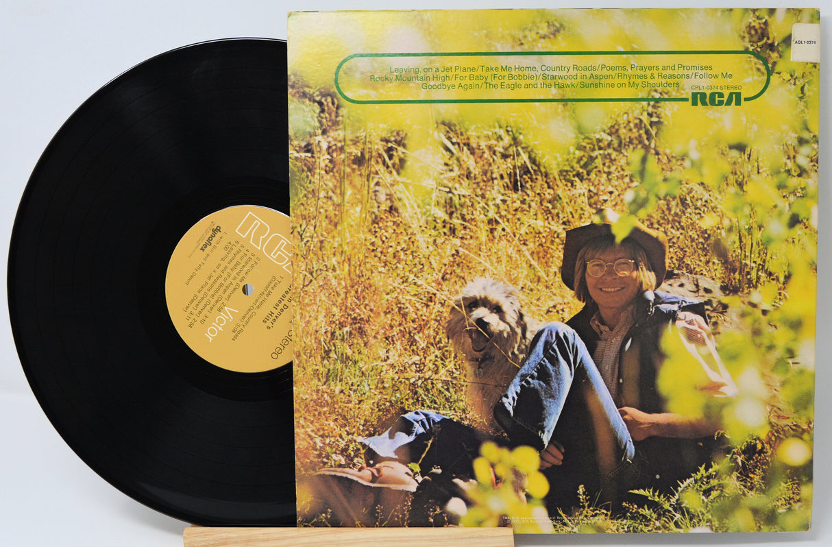 Vinyl record with cover featuring a person and dog in a field, with 'RCA' branding.