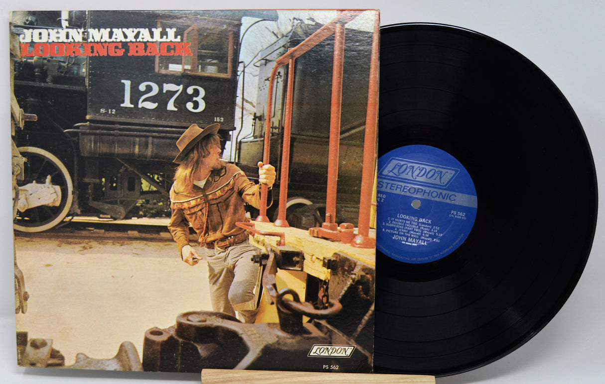 Vinyl record with cover featuring song list on a white background