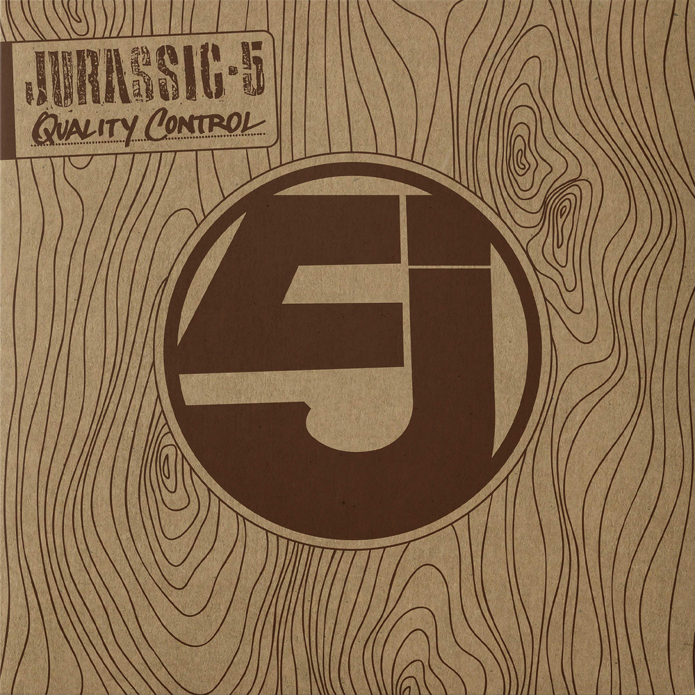 Wooden texture background with a logo and text 'Jurassic 5 Quality Control' in the center.