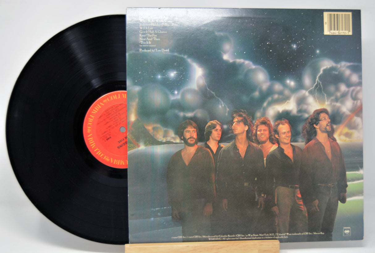 'Kenny Loggins Keep The Fire' Vinyl record with a colorful album cover featuring six band members.