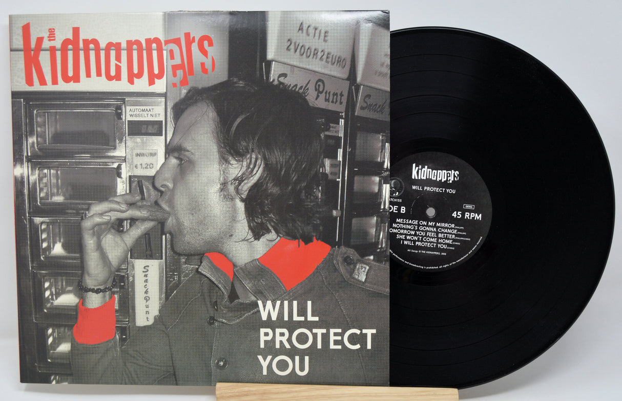 Vinyl record with cover featuring a person and text 'kidnappys' on a white background