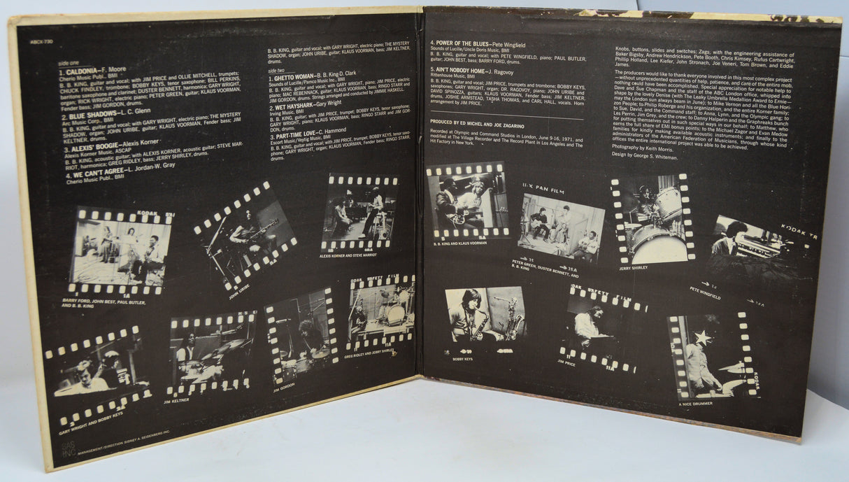 Open book with black and white film strip illustrations on a white background