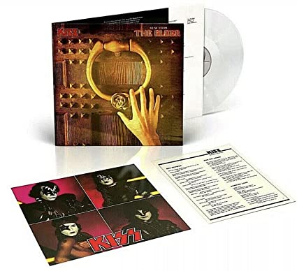 A vinyl record titled 'Kiss - Music from the Elder' with an image of a hand holding a large, gold-colored ring on a dark, wooden door.
