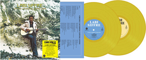 Yellow vinyl records with a person playing guitar on the cover, set against a mountainous background.