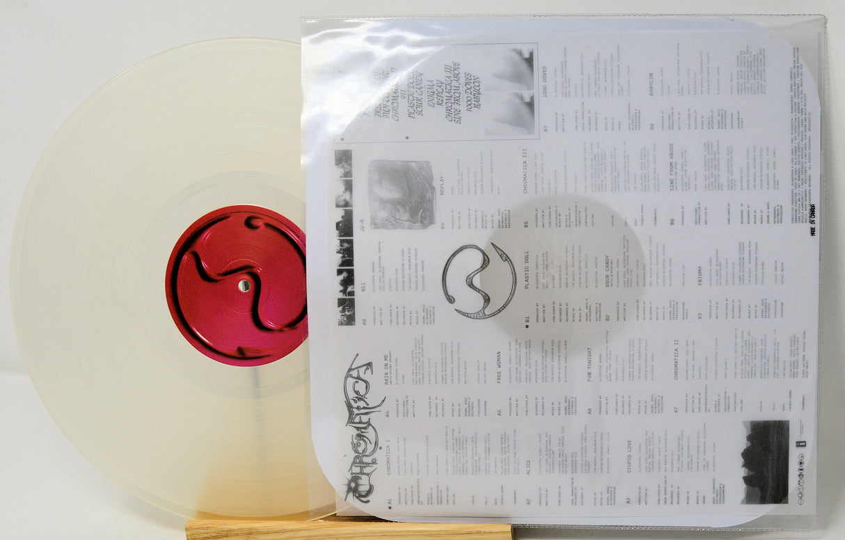 Vinyl record with a red label and its packaging on a white background