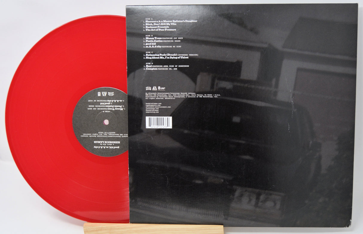 Vinyl cover featuring people sitting at a table with their eyes black out by a black bar