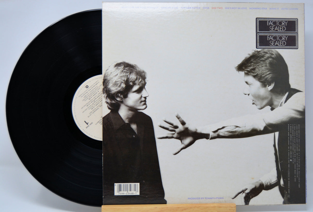 'Larsen Feiten Band Self Titled' Vinyl record with a black and white cover featuring two people reaching towards each other.