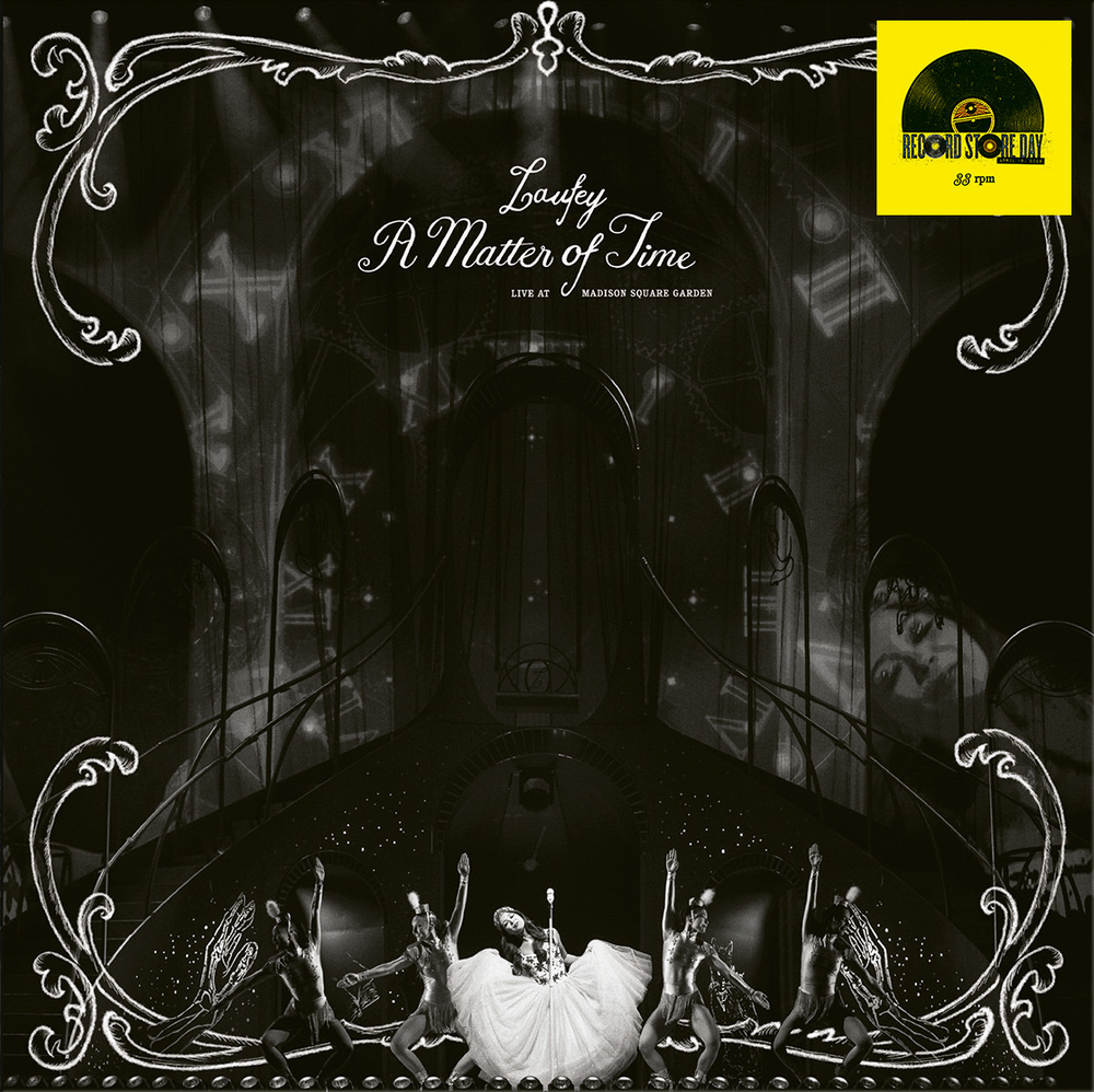 Album cover with dancers and text 'A Matter of Time' on a dark background